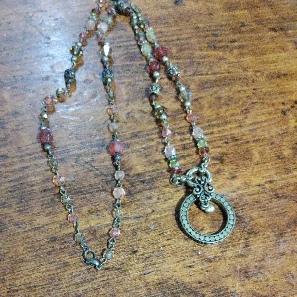 Elegant Beaded Necklace with Antique Gold Pendant